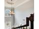Bright foyer with a chandelier, high ceilings and a view of the front door at 7933 Heathmore Dr, Fairburn, GA 30213