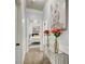 Inviting hallway featuring stylish decor with a view into the secondary bedroom at 7933 Heathmore Dr, Fairburn, GA 30213