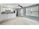 Kitchen with white cabinets, stainless steel appliances, and access to the backyard at 7933 Heathmore Dr, Fairburn, GA 30213