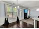 Bright, spacious living room with hardwood floors, fireplace and large window at 7933 Heathmore Dr, Fairburn, GA 30213