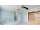 Bright living room with modern ceiling fan and paint, and soft carpet at 7933 Heathmore Dr, Fairburn, GA 30213