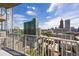 Balcony view shows the vibrant city skyline and modern architecture at 860 Peachtree Ne St # 2209, Atlanta, GA 30308