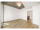 Bedroom with hardwood floors, neutral walls, en-suite bath, and balcony access at 860 Peachtree Ne St # 2209, Atlanta, GA 30308