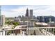 Enjoy the cityscape view from the balcony with clear skies and modern architecture at 860 Peachtree Ne St # 2209, Atlanta, GA 30308