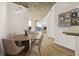 Inviting dining area adjacent to the kitchen and living spaces, featuring contemporary lighting and comfortable seating at 860 Peachtree Ne St # 2209, Atlanta, GA 30308
