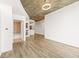Open-concept living room featuring modern lighting, wood floors, and easy access to the bathroom at 860 Peachtree Ne St # 2209, Atlanta, GA 30308