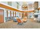 Community lounge featuring ample seating, a fireplace, and a stylish design at 860 Peachtree Ne St # 2209, Atlanta, GA 30308