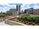 Beautiful rooftop garden with vibrant flowers, lush greenery, and skyline views at 860 Peachtree Ne St # 2209, Atlanta, GA 30308