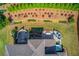 Breathtaking aerial view of backyard featuring a patio, pool and manicured garden at 1074 Nash Springs Cir, Lilburn, GA 30047