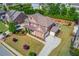 Stunning aerial view of a meticulously landscaped property highlighting the backyard and lush greenery at 1074 Nash Springs Cir, Lilburn, GA 30047
