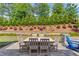 Beautiful backyard with a patio, seating and lush landscaping at 1074 Nash Springs Cir, Lilburn, GA 30047