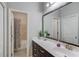 Bathroom with granite counters, modern vanity, a large mirror, and a shower/tub combination at 1074 Nash Springs Cir, Lilburn, GA 30047