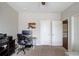Carpeted bedroom features white trim, a ceiling fan and access to other rooms at 1074 Nash Springs Cir, Lilburn, GA 30047