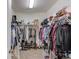 Walk-in closet provides ample storage with shelving and hanging space for clothing and accessories at 1074 Nash Springs Cir, Lilburn, GA 30047