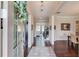 Welcoming foyer with dark hardwood floors, neutral walls, elegant decor, and views into other rooms at 1074 Nash Springs Cir, Lilburn, GA 30047