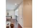 Bright hallway with hardwood floors and wrought iron banister adds elegance at 1074 Nash Springs Cir, Lilburn, GA 30047