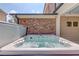 Inviting hot tub set against a brick wall, for relaxation and entertainment at 1074 Nash Springs Cir, Lilburn, GA 30047