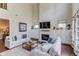 Bright living room with soaring ceilings, fireplace, built-in cabinets, and comfortable seating at 1074 Nash Springs Cir, Lilburn, GA 30047