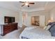 Spacious main bedroom features carpet floors, neutral paint, and access to other areas of the home at 1074 Nash Springs Cir, Lilburn, GA 30047