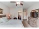 The primary bedroom has a ceiling fan, an ensuite bath, and modern furniture at 1074 Nash Springs Cir, Lilburn, GA 30047
