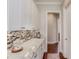 Walk-in pantry with white cabinetry, granite countertops, and stylish backsplash at 1074 Nash Springs Cir, Lilburn, GA 30047