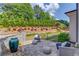 Stunning backyard patio showcasing stylish outdoor furniture, lush landscaping, and a tranquil setting at 1074 Nash Springs Cir, Lilburn, GA 30047