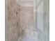Modern glass shower features custom tile work, built in shower bench, and updated fixtures at 1074 Nash Springs Cir, Lilburn, GA 30047