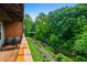 Scenic balcony overlooking green space and a stream, perfect for relaxation and enjoying nature's beauty at 1635 Briarcliff Rd # 8, Atlanta, GA 30306