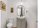 Charming powder room with a modern vanity, arched mirror, and neutral color palette at 1635 Briarcliff Rd # 8, Atlanta, GA 30306