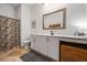 Bright bathroom with a floral shower curtain and a large white vanity at 1635 Briarcliff Rd # 8, Atlanta, GA 30306