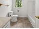 Clean bathroom featuring tile flooring, a bathtub and a toilet at 37 S Forty W Pass, Hiram, GA 30141