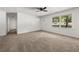 Bright living room with neutral carpet, large windows offering backyard views, and a welcoming entrance at 37 S Forty W Pass, Hiram, GA 30141