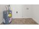 Utility room featuring tile floors and water heater at 37 S Forty W Pass, Hiram, GA 30141