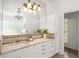 Bathroom with marble countertops, a large mirror, and access to outside at 3818 Sweet Bottom Dr, Duluth, GA 30096
