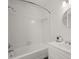 Bathroom with a standard white tub, shower, and white vanity with sink at 3818 Sweet Bottom Dr, Duluth, GA 30096