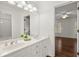 Bathroom features double sinks with a large mirror and access to another room at 3818 Sweet Bottom Dr, Duluth, GA 30096