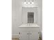 Bathroom with a sink, cabinet, and a large mirror at 3818 Sweet Bottom Dr, Duluth, GA 30096