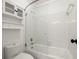 Bathroom featuring a shower and tub combo, with a glass partition at 3818 Sweet Bottom Dr, Duluth, GA 30096