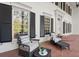 Inviting front porch with comfortable seating and classic architectural details at 3818 Sweet Bottom Dr, Duluth, GA 30096