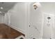 Hallway with beautiful hardwood floors and plenty of light from the windows at 3818 Sweet Bottom Dr, Duluth, GA 30096