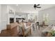 Bright open-concept living room with fireplace, hardwood floors, and access to the modern kitchen at 3818 Sweet Bottom Dr, Duluth, GA 30096