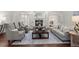 Inviting living room with French doors, fireplace, comfortable seating, and a stylish rug at 3818 Sweet Bottom Dr, Duluth, GA 30096