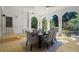 Covered patio with a dining table set, porch swing, and views of the backyard at 3818 Sweet Bottom Dr, Duluth, GA 30096