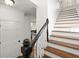 Beautiful staircase with wood treads and white risers leads to the upper level at 3818 Sweet Bottom Dr, Duluth, GA 30096
