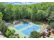Community tennis courts surrounded by lush trees and greenery at 3818 Sweet Bottom Dr, Duluth, GA 30096