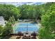 Aerial view of the community tennis courts, with lush green trees and gazebo at 3818 Sweet Bottom Dr, Duluth, GA 30096