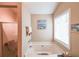 Bathroom showcasing a soaking tub with a large window allowing for natural light at 4872 Nature Trl, Austell, GA 30106