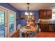 Inviting dining room with wood floors, a hutch, and French doors leading to the patio at 4872 Nature Trl, Austell, GA 30106
