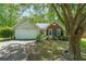 Charming single-Gathering home with brick and siding, features a well-maintained yard, and attached garage at 4872 Nature Trl, Austell, GA 30106