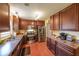 Well-equipped kitchen with stainless steel appliances, wood cabinets, and laminate countertops at 4872 Nature Trl, Austell, GA 30106